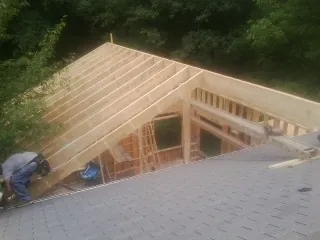Framing a new roof addition that ties into an existing shingle roof in Leonard